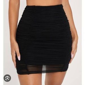 Meshki Mattea Ruched Mesh Mini Skirt in black. Size XXS. Roughly 17”. NWT.